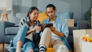 Young couple shopping online for home furnishings.